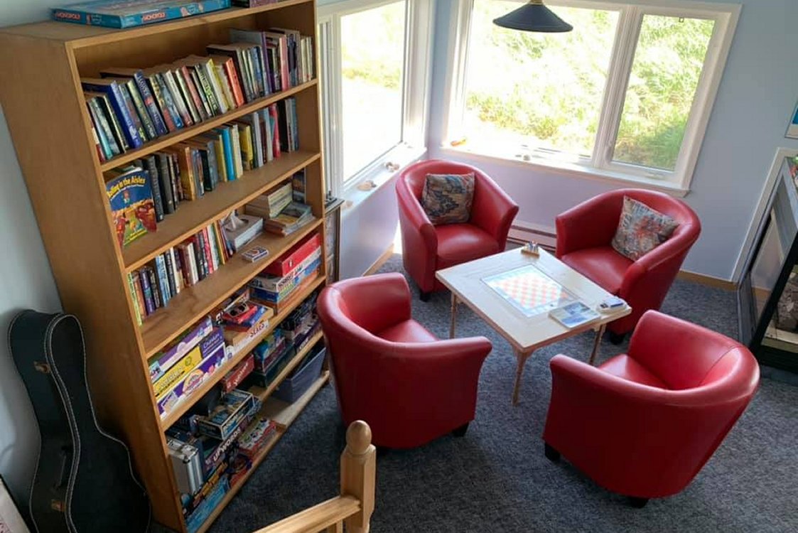 Seating for 4 people next to corner window in the large guest common room