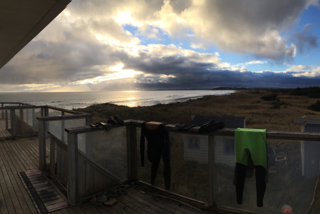 View from second floor deack: ocean waves, and natural, pristine coastlines.